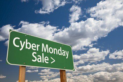 Cyber Monday Sale Green Road Sign with Dramatic Clouds and Sky.