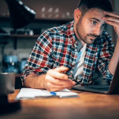 Man at computer in dark room